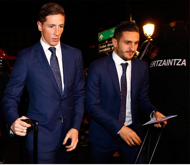 Fernando Torres and Koke wearing a Roberto Verino suit