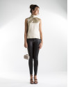 Sandy-colored top with high collar