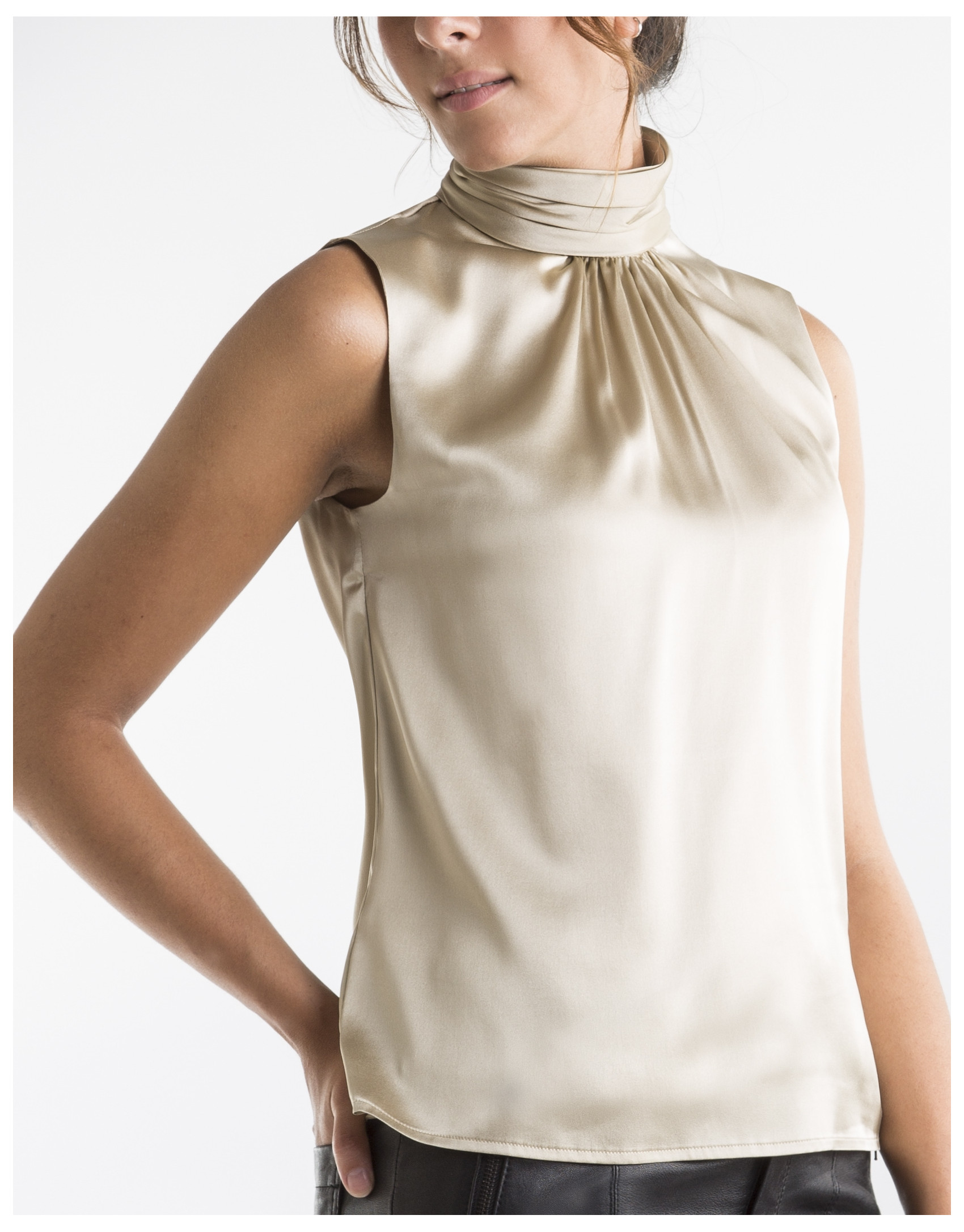 Sandy-colored top with high collar