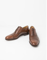 Brown Oxford dress shoes
