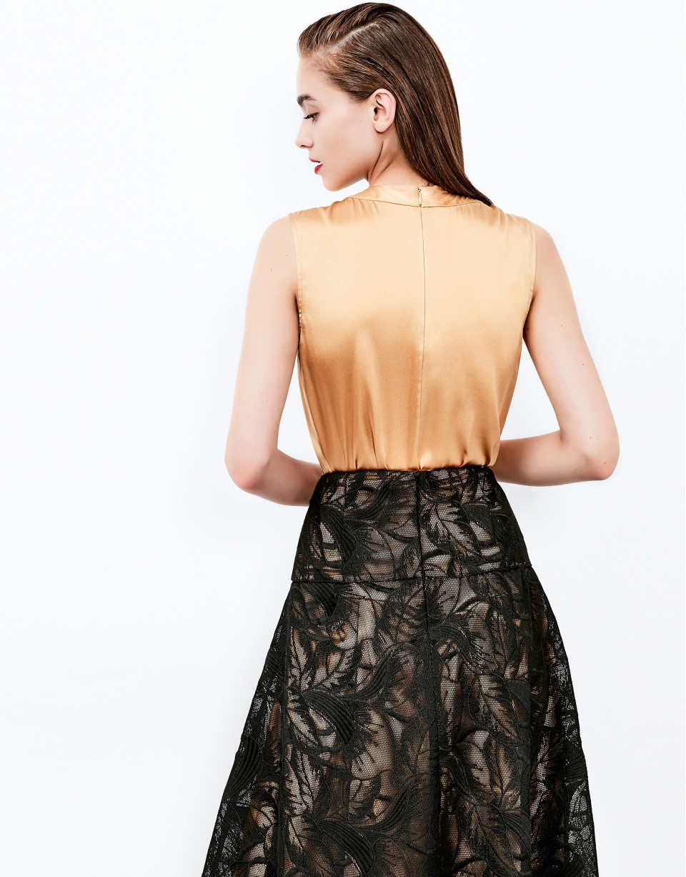Gold top with decorative folds