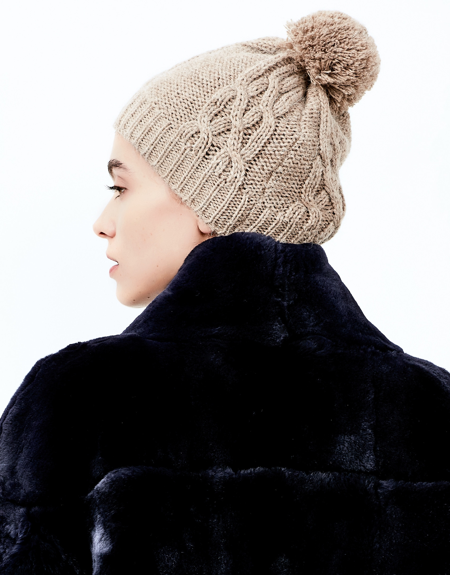 Beige knit cap with pompom