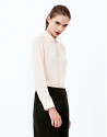 Beige shirt with central pleat
