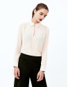 Beige shirt with central pleat