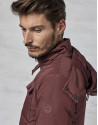 Maroon windbreaker with hood and fur collar