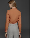Orange shirt with bow collar