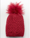 Gorro de lana con pompón rojo