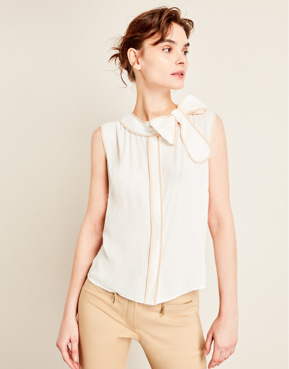 Beige top with bow