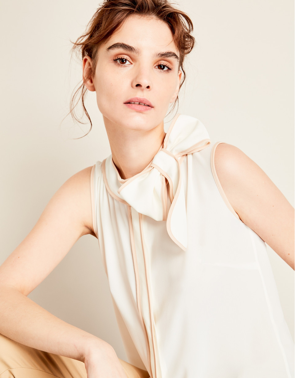 Beige top with bow