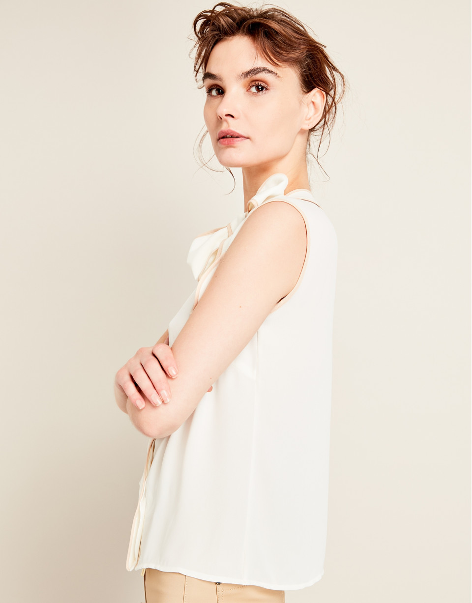 Beige top with bow