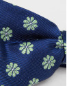 Navy blue bowtie with jacquard green daisies