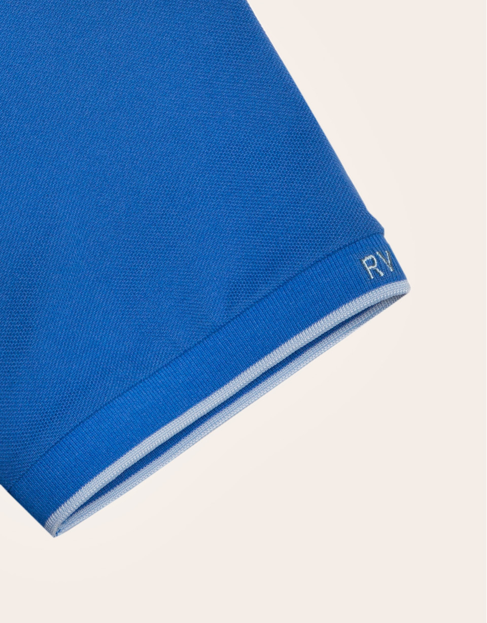 Polo piqué azul y contraste celeste