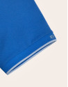 Polo piqué azul y contraste celeste