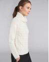 White sweater with stovepipe collar and decoration