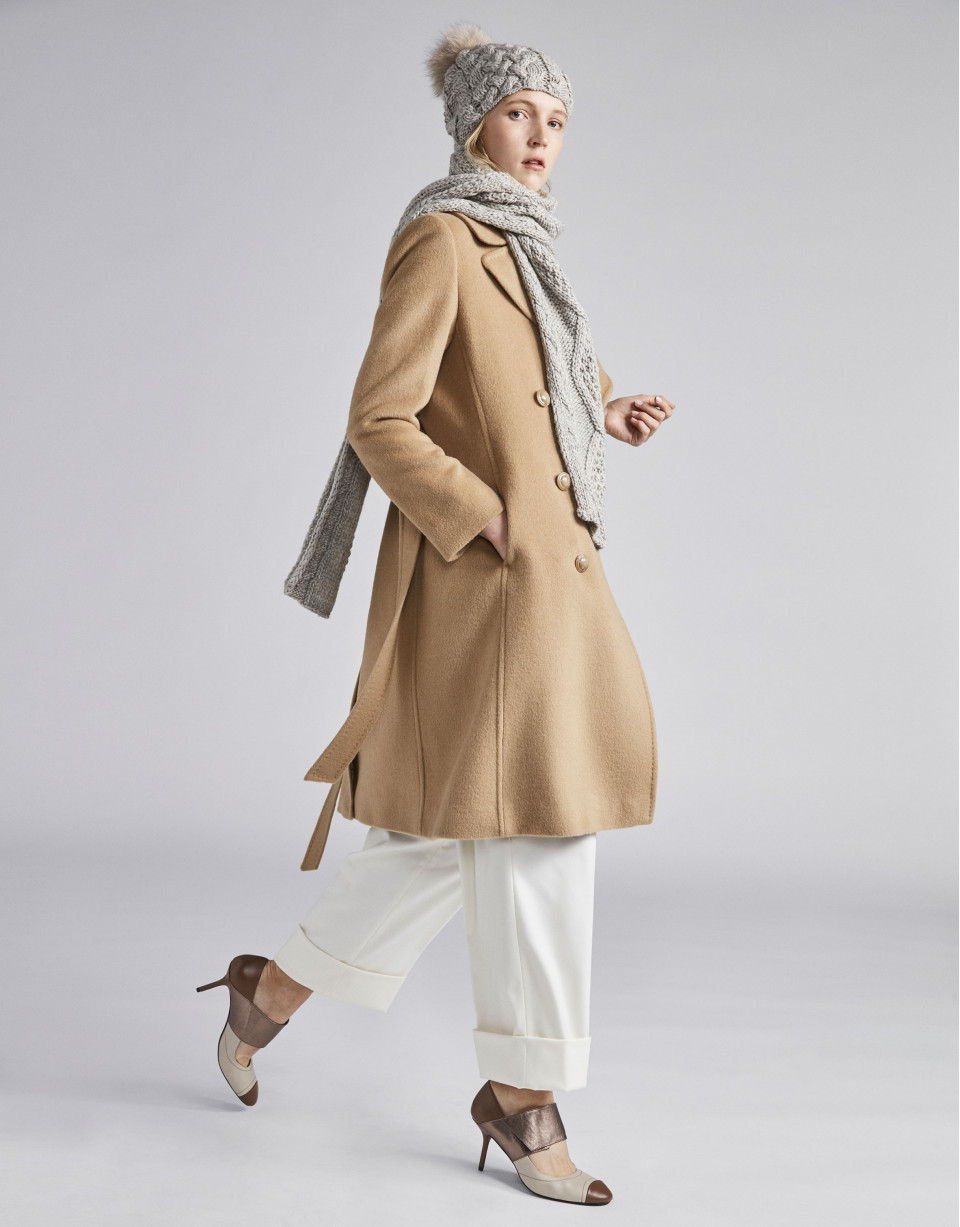 Beige cloth coat with triple row of  buttons