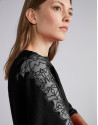 Black sweater with bat sleeves