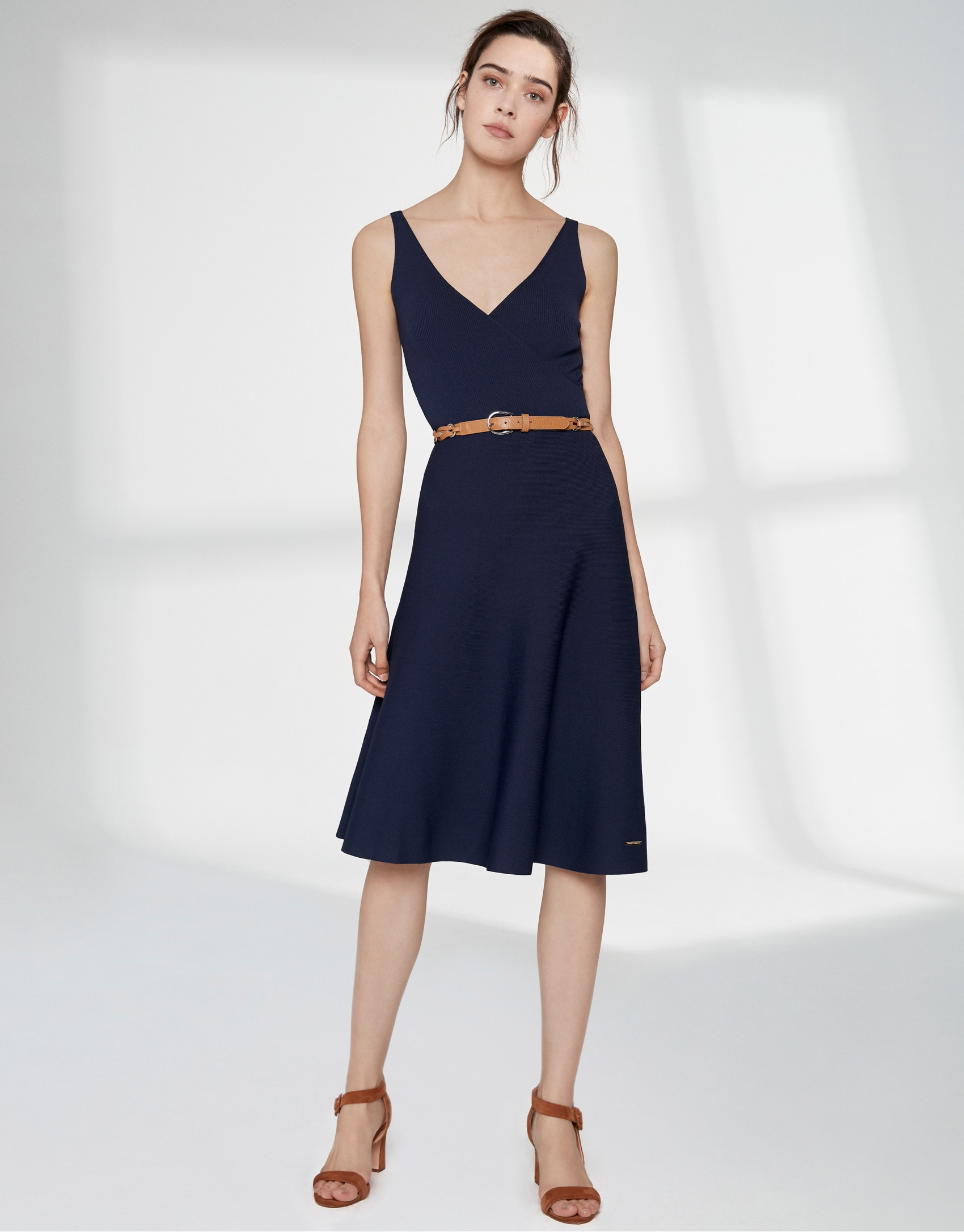 Navy blue knit dress with crossover neckline