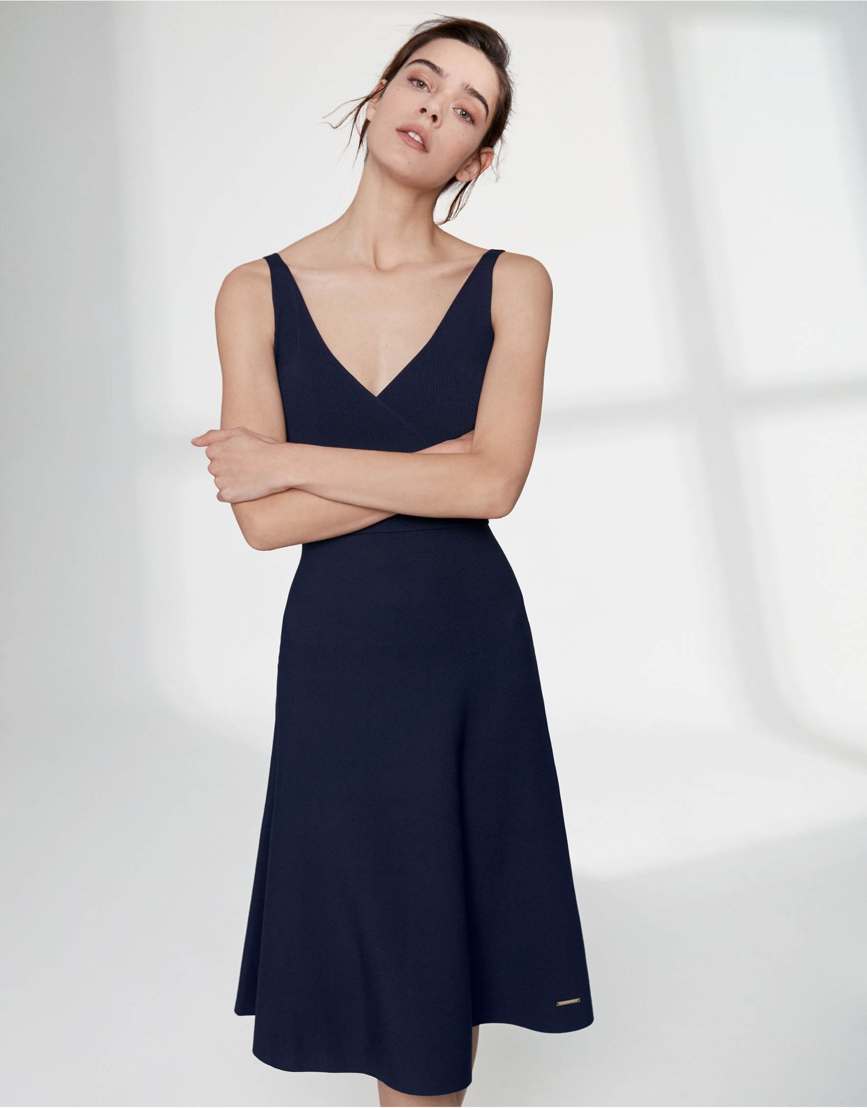 Navy blue knit dress with crossover neckline