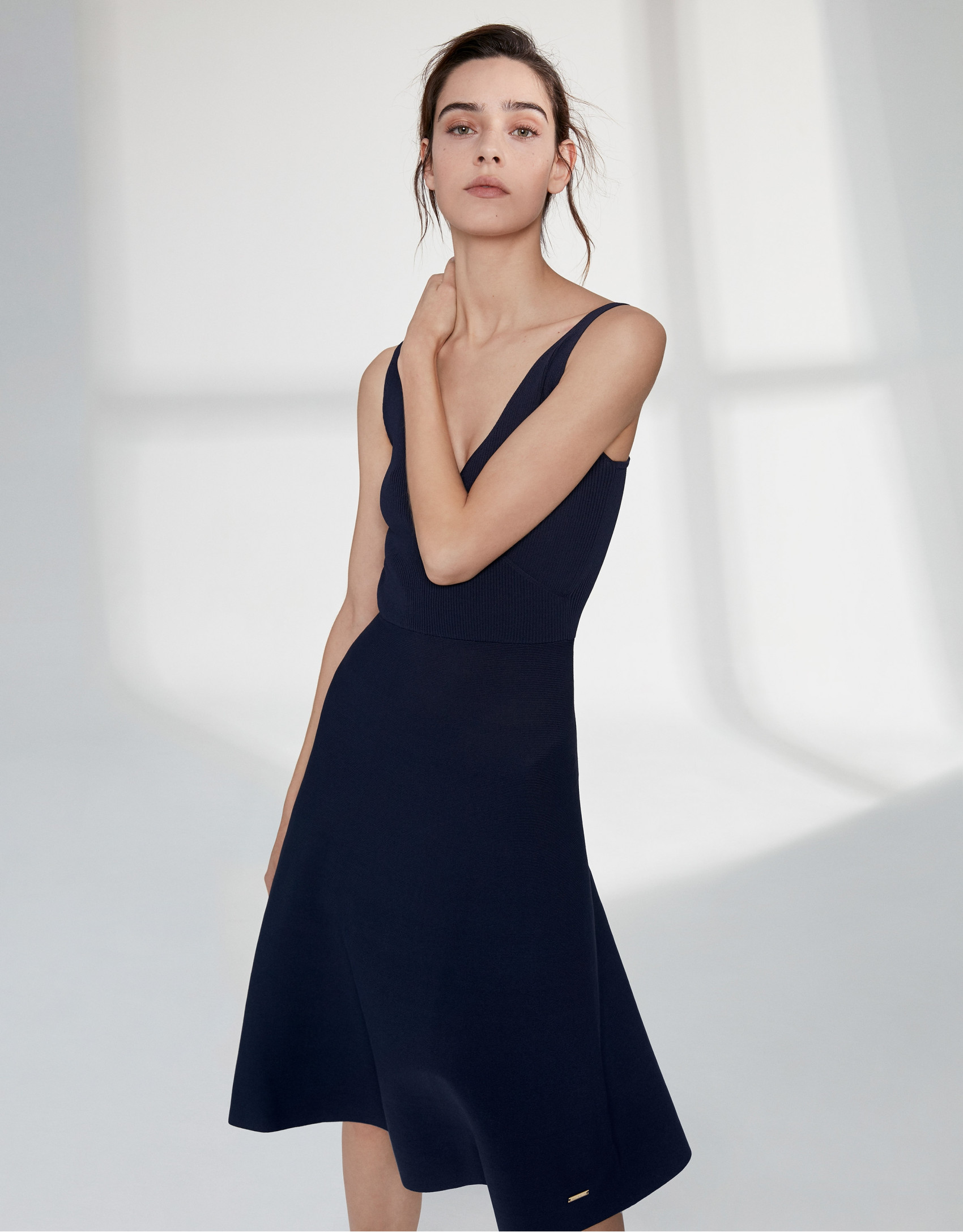 Navy blue knit dress with crossover neckline