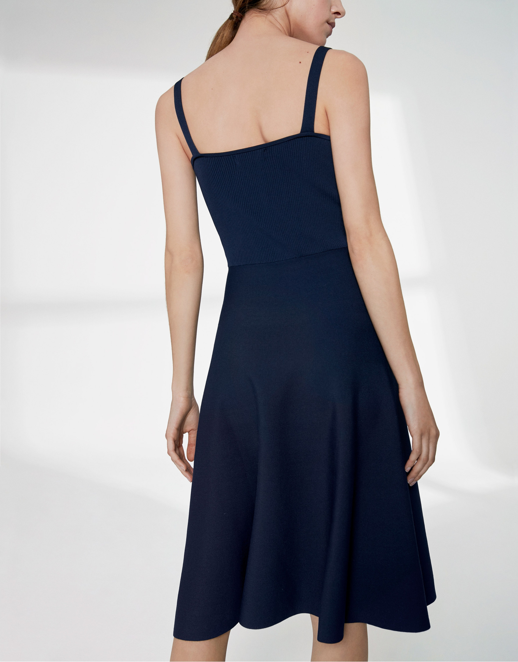 Navy blue knit dress with crossover neckline