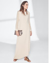 Sandy-colored dress with asymmetric hem