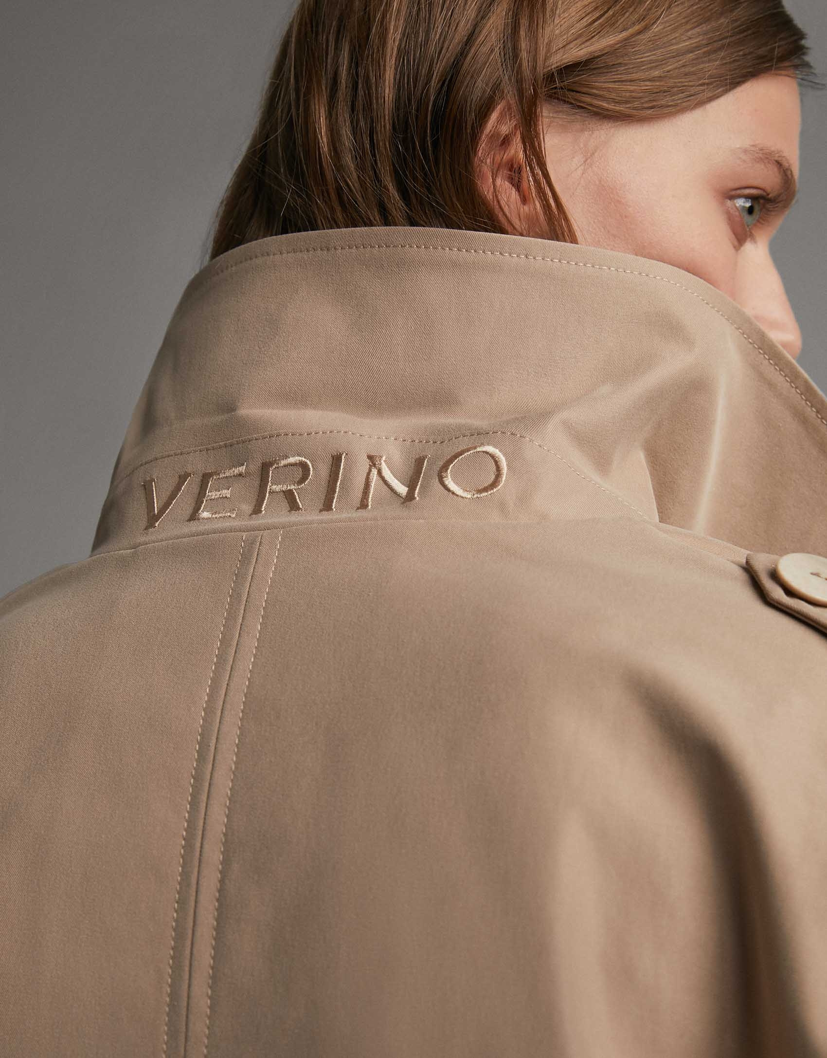 Short beige parka with double row of buttons
