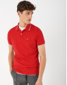Red pique cotton polo shirt with white outlines
