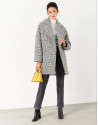 Short oversize coat with black and white checked pattern