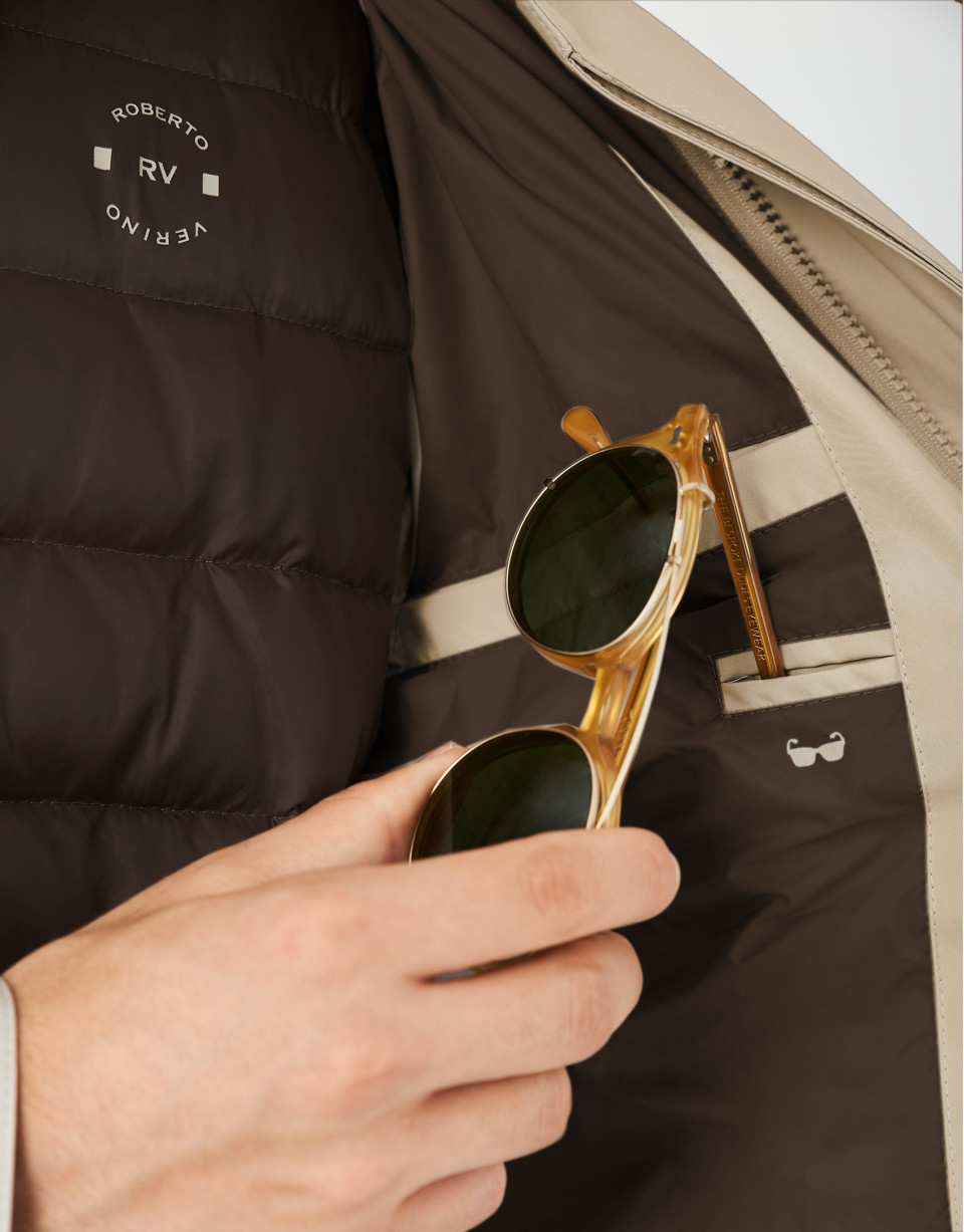 Sandy-colored minimal gabardine with brown windbreaker