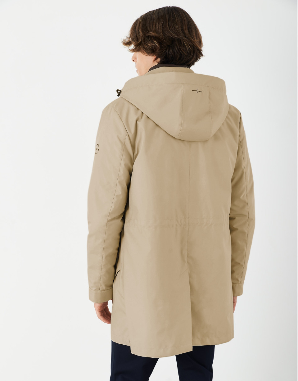Sandy-colored minimal gabardine with brown windbreaker