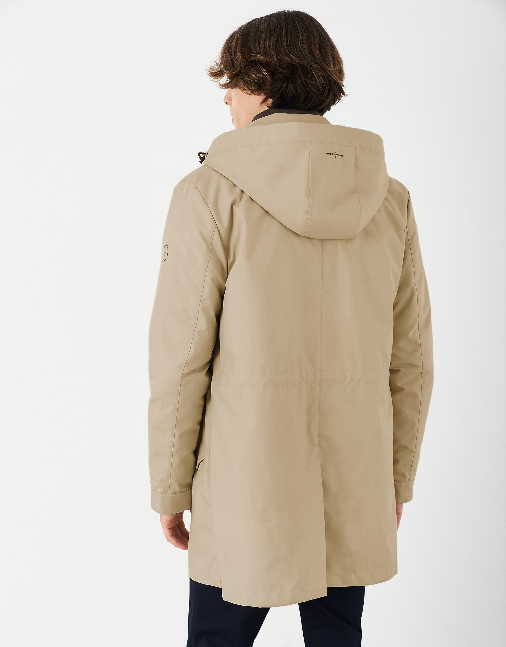 Sandy-colored minimal gabardine with brown windbreaker