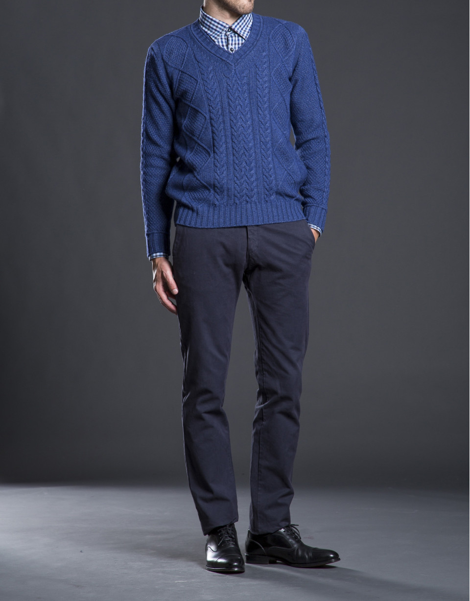 Blue V-neck sweater with cable stitch design 