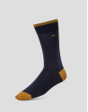 Two pairs of socks, one with a navy blue and yellow design and the other with navy blue and green stripes