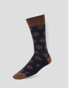 Two pairs of socks, one with a navy blue and white design and the other with a blue and camel design 