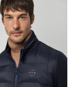 Navy blue quilted windbreaker with knit sleeves