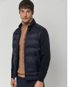 Navy blue quilted windbreaker with knit sleeves