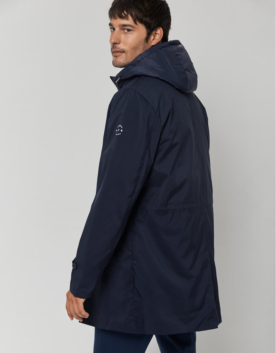 Navy blue tech fabric raincoat with blue quilted vest