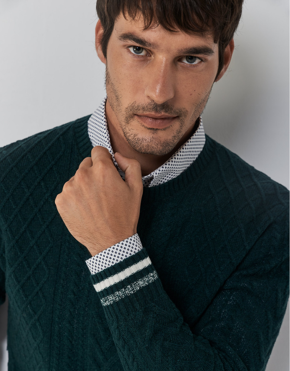 Green cable-knit wool sweater with stripes on the cuffs