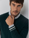 Green cable-knit wool sweater with stripes on the cuffs
