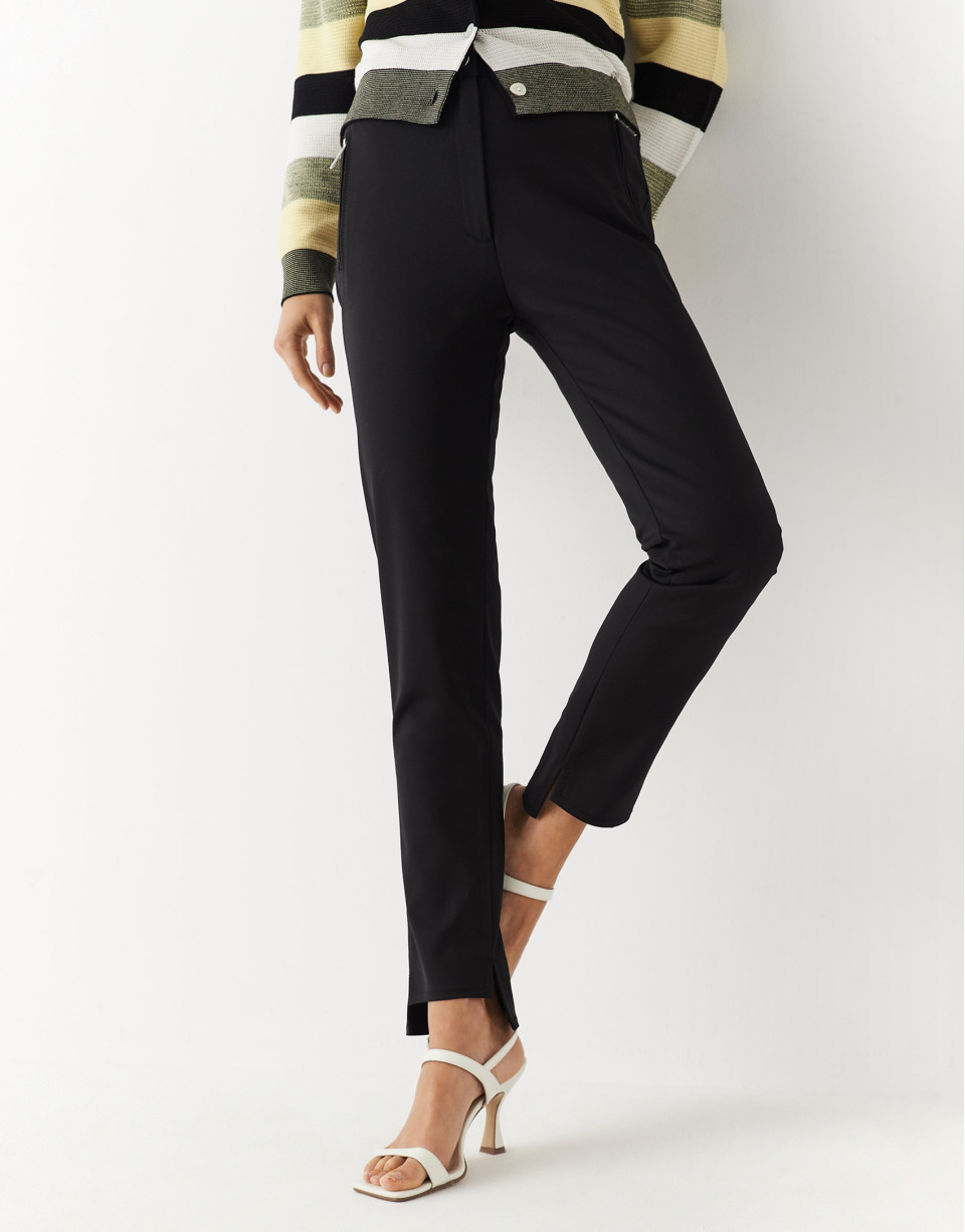 Black colored fitted pants with zippered pockets | Roberto Verino
