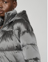 Gray quilted windbreaker with hood and side slits 