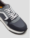 Gray running shoes with track sole