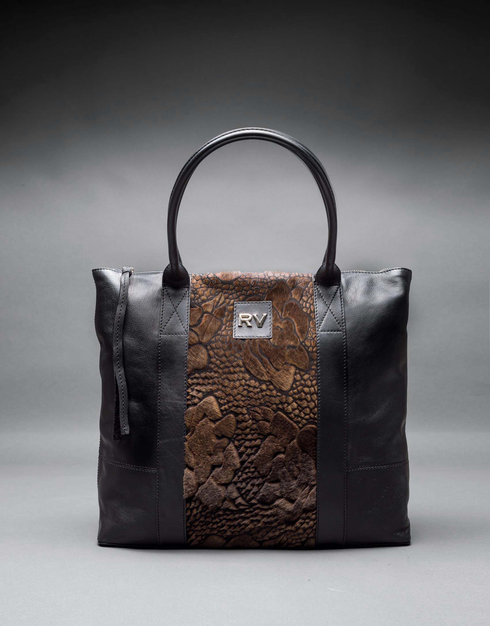Bolso Orlando Soft en napa negra y pelo troquelado fastasía flor en tostados