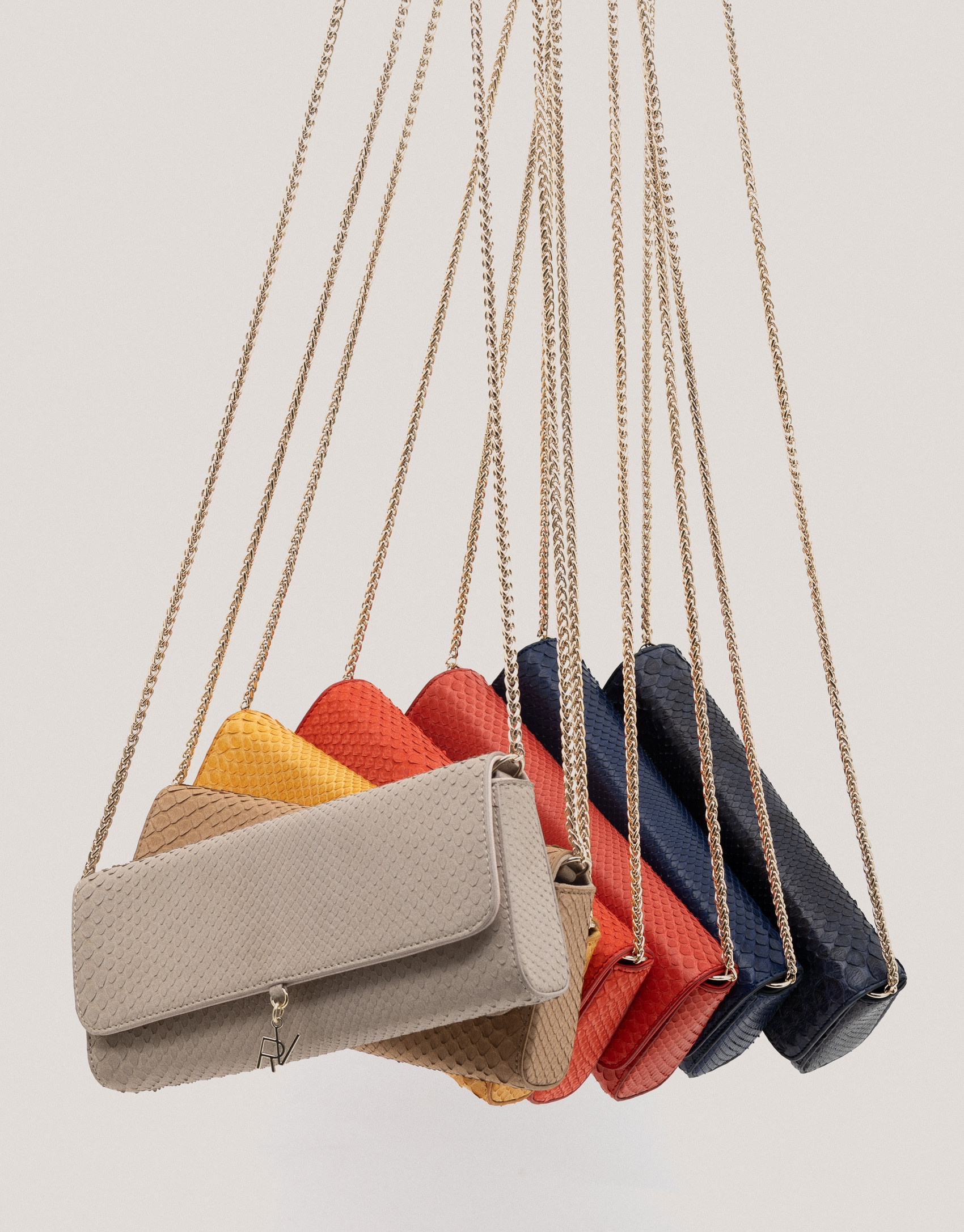 Bolso Clutch Ariana piel serpiente mostaza | Roberto Verino