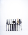 Black and white striped leather Miranda Bahía messenger bag 