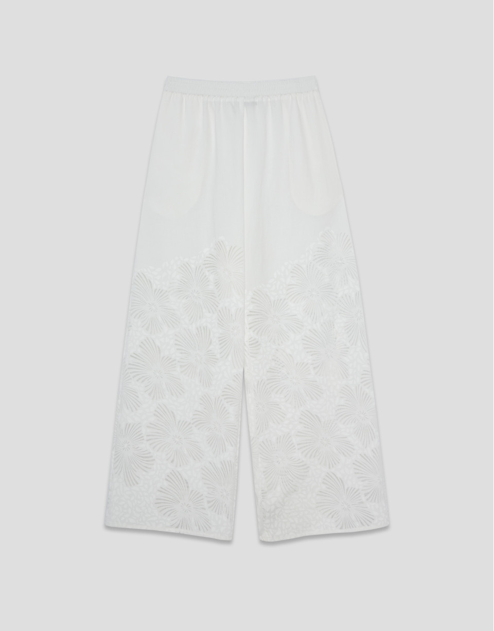 Palazzo pants with floral design in white devoré | Roberto Verino