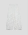 Palazzo pants with floral design in white devoré | Roberto Verino