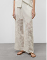 Palazzo pants with floral design in white devoré | Roberto Verino