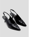 Black leather slingback court shoe with cuts