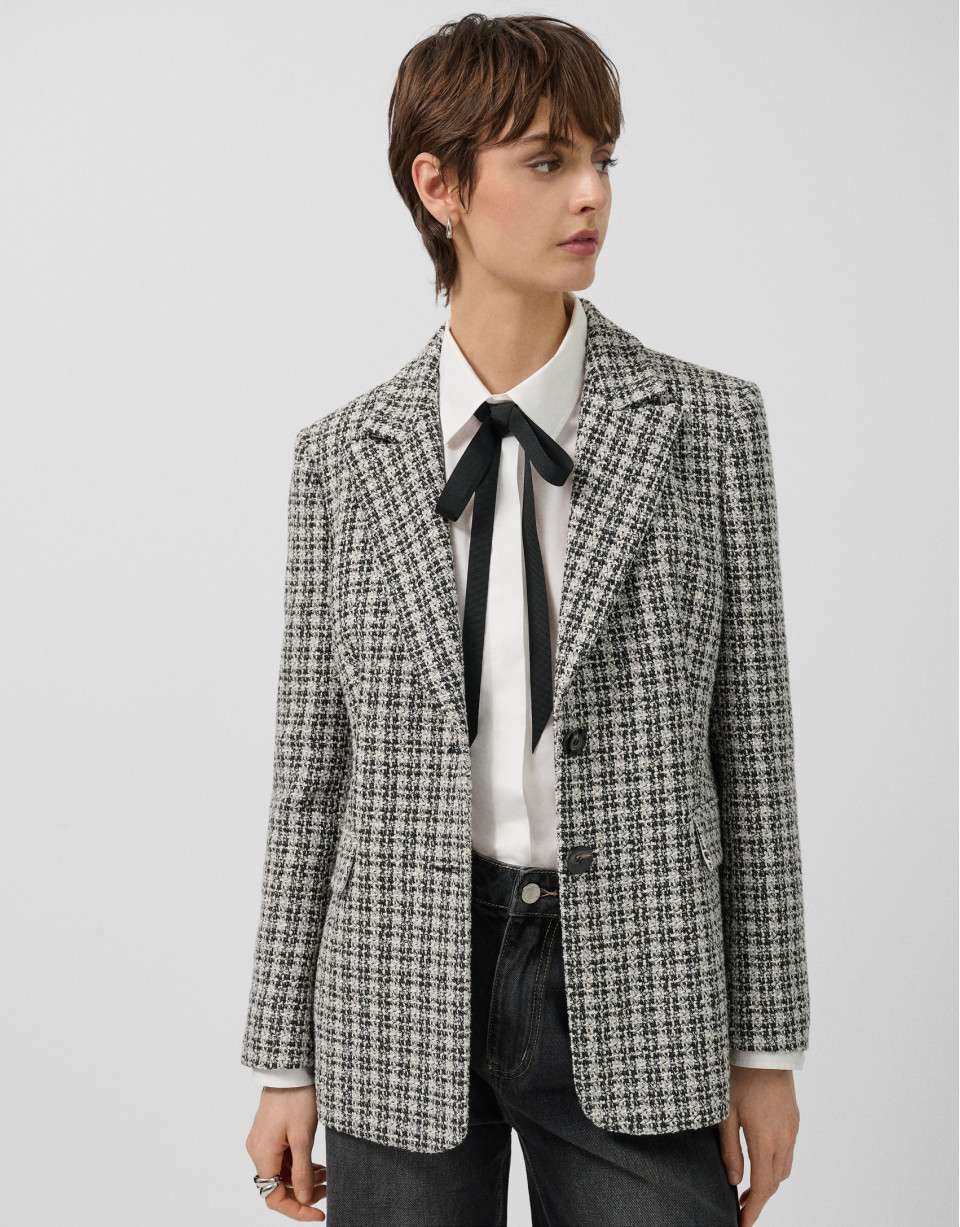 Short black and white tweed jacket with gold ... | Roberto Verino